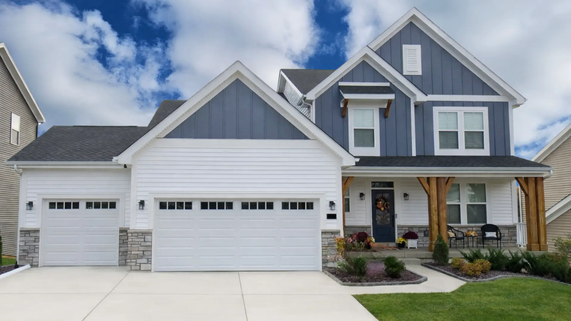 Streets of Caledonia home by Fischer Homes — white-and-grey two-story with double garage.
