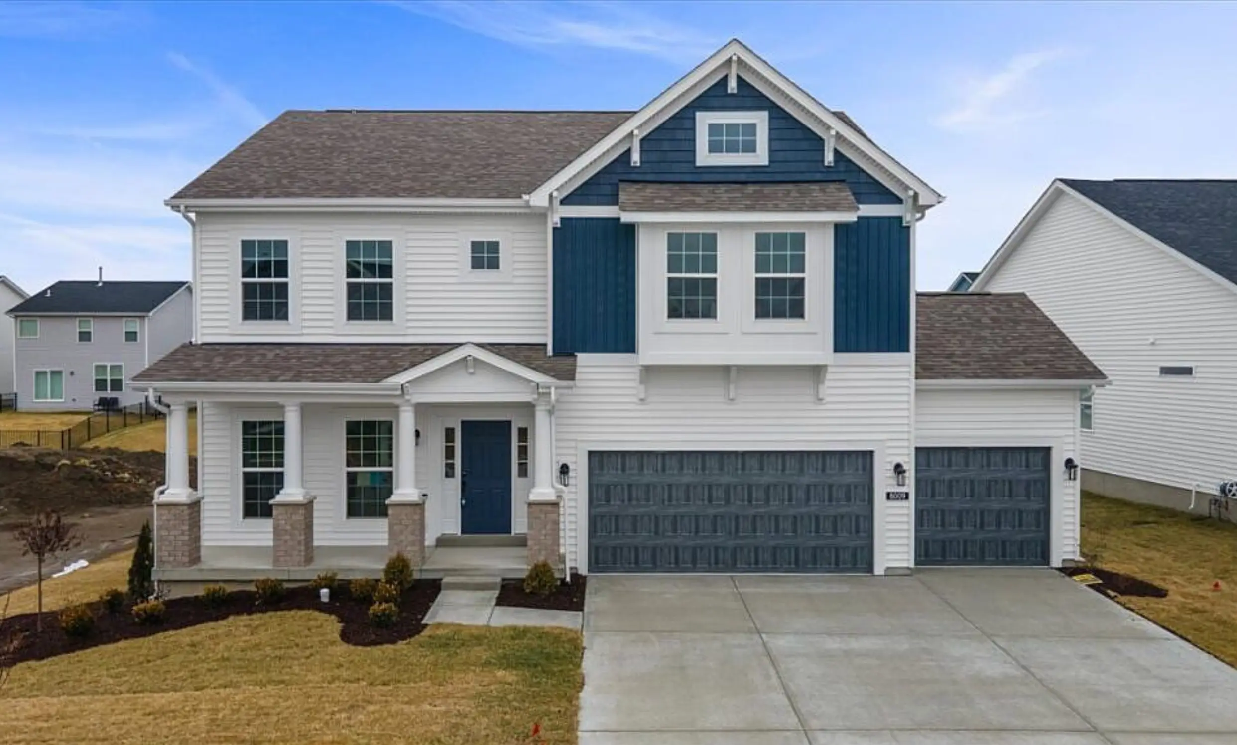 Santiago floor plan — white-and-navy two-story home with covered front porch.